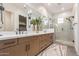 Modern bathroom with double vanity, large mirror, and walk-in shower at 10986 N Northfield St, Surprise, AZ 85388