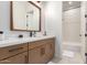 Clean bathroom with single vanity, white subway tile, and bathtub at 10986 N Northfield St, Surprise, AZ 85388