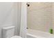 Simple bathroom with shower/tub combo and white subway tile at 10986 N Northfield St, Surprise, AZ 85388