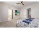 Comfortable bedroom with a king-size bed and en-suite bathroom at 10986 N Northfield St, Surprise, AZ 85388