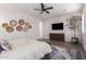 Main bedroom with ceiling fan, large windows and decor at 10986 N Northfield St, Surprise, AZ 85388