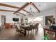 Dining area with rustic wooden table and access to backyard at 10986 N Northfield St, Surprise, AZ 85388