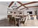 Open concept dining room with large wooden table and chandelier at 10986 N Northfield St, Surprise, AZ 85388