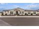 Single-story home with a Spanish-style facade and landscaped front yard at 10986 N Northfield St, Surprise, AZ 85388