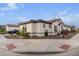 Side view of the house showcasing the garage and landscaping at 10986 N Northfield St, Surprise, AZ 85388