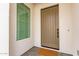 Modern front door with a window to the side at 10986 N Northfield St, Surprise, AZ 85388