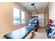 Garage with golf cart, storage, and large windows at 10986 N Northfield St, Surprise, AZ 85388
