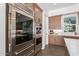 Stainless steel built-in oven and refrigerator in modern kitchen at 10986 N Northfield St, Surprise, AZ 85388