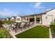 Relaxing pool area with lounge chairs and covered patio at 10986 N Northfield St, Surprise, AZ 85388