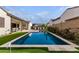 Inviting rectangular pool with surrounding patio and grassy area at 10986 N Northfield St, Surprise, AZ 85388