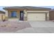 Single-story home with tan stucco exterior and two-car garage at 11468 W Deanne Dr, Youngtown, AZ 85363