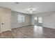 Bright living room with wood-look flooring and sliding glass doors at 11468 W Deanne Dr, Youngtown, AZ 85363