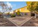 Spacious backyard with a large grassy area and brick walkway at 11867 W Grant St, Avondale, AZ 85323