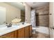 Clean bathroom with double vanity and shower/tub combo at 11867 W Grant St, Avondale, AZ 85323