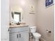 Clean bathroom with granite vanity, toilet and framed mirror at 11867 W Grant St, Avondale, AZ 85323