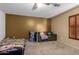 Multipurpose bedroom with a sofa and plenty of storage at 11867 W Grant St, Avondale, AZ 85323