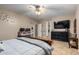 Main bedroom with a large TV and ensuite bathroom at 11867 W Grant St, Avondale, AZ 85323