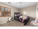 Simple bedroom with a double bed and a full-length mirror at 11867 W Grant St, Avondale, AZ 85323