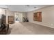 Spacious bonus room with large window and neutral carpeting at 11867 W Grant St, Avondale, AZ 85323