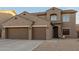 Two-story house with three car garage and desert landscaping at 11867 W Grant St, Avondale, AZ 85323