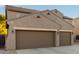 Two-story house with three car garage and desert landscaping at 11867 W Grant St, Avondale, AZ 85323