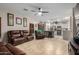 Open living room and kitchen with recessed lighting and tiled floor at 11867 W Grant St, Avondale, AZ 85323