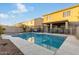 Inviting backyard pool with a spa and patio area at 11867 W Grant St, Avondale, AZ 85323