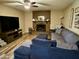 Cozy living room featuring a brick fireplace and comfortable seating at 12016 N 61St Ave, Glendale, AZ 85304