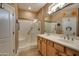 Double vanity bathroom with a large walk in shower at 12824 W Junipero Dr, Sun City West, AZ 85375