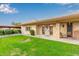 Another view of the condo building, showcasing the building's exterior and landscaping at 12828 N 113Th Ave # 4, Youngtown, AZ 85363