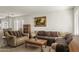 Living room with two sofas, a coffee table, and a neutral color scheme at 1330 S 219Th Dr, Buckeye, AZ 85326