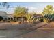 Landscaped backyard with desert plants and a paved patio at 13555 W Via Tercero --, Sun City West, AZ 85375