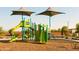 Modern playground with slides and climbing structures at 15656 W Mercer Ln, Surprise, AZ 85379