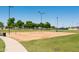 Beach volleyball court next to a walkway at 15656 W Mercer Ln, Surprise, AZ 85379