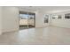 Dining area with light flooring and access to backyard at 15664 W Mercer Ln, Surprise, AZ 85379