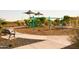 Community playground with swings and shade structures at 15664 W Mercer Ln, Surprise, AZ 85379