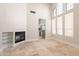 Living room with high ceilings, fireplace, and kitchen access at 16218 S 24Th Pl, Phoenix, AZ 85048