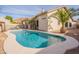 Inviting kidney-shaped pool with a large deck, located in a sunny backyard at 16218 S 24Th Pl, Phoenix, AZ 85048