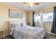 Bedroom with queen-size bed and window overlooking the street at 17621 N 18Th Dr, Phoenix, AZ 85023