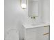 Modern bathroom with white vanity, gold fixtures, and a large mirror at 2015 W Chambers St, Phoenix, AZ 85041