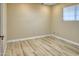 Bright bedroom with light colored walls and wood flooring at 2015 W Chambers St, Phoenix, AZ 85041