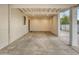 Covered carport with concrete flooring and overhead lighting at 2015 W Chambers St, Phoenix, AZ 85041