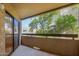 Private balcony with sliding glass door and treetop views at 2228 N 52Nd St # 240, Phoenix, AZ 85008