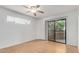 Spacious bedroom with wood floors, ceiling fan and private balcony access at 2228 N 52Nd St # 240, Phoenix, AZ 85008