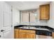 Clean kitchen with wood cabinets, granite countertops, and stainless steel appliances at 2228 N 52Nd St # 240, Phoenix, AZ 85008
