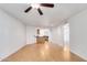 Living room with wood floors, ceiling fan and access to patio at 2228 N 52Nd St # 240, Phoenix, AZ 85008