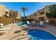 Community pool and spa with lounge chairs at 2228 N 52Nd St # 240, Phoenix, AZ 85008