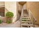 Exterior condo entry with a stairway leading to the unit at 2228 N 52Nd St # 240, Phoenix, AZ 85008