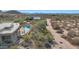 Aerial view showing desert landscape, pool, and home at 24200 N Alma School Rd # 2, Scottsdale, AZ 85255