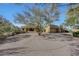 Single-story home with circular driveway and mature trees at 24200 N Alma School Rd # 2, Scottsdale, AZ 85255